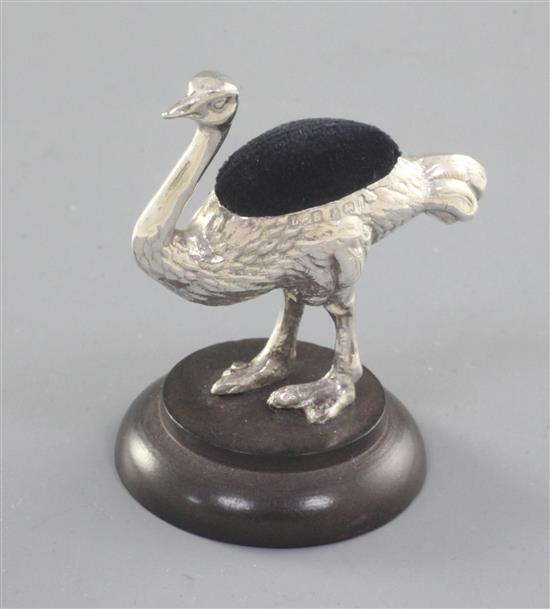 An Edwardian silver mounted novelty Ostrich pin cushion, by Levi & Salaman, overall height 57mm.